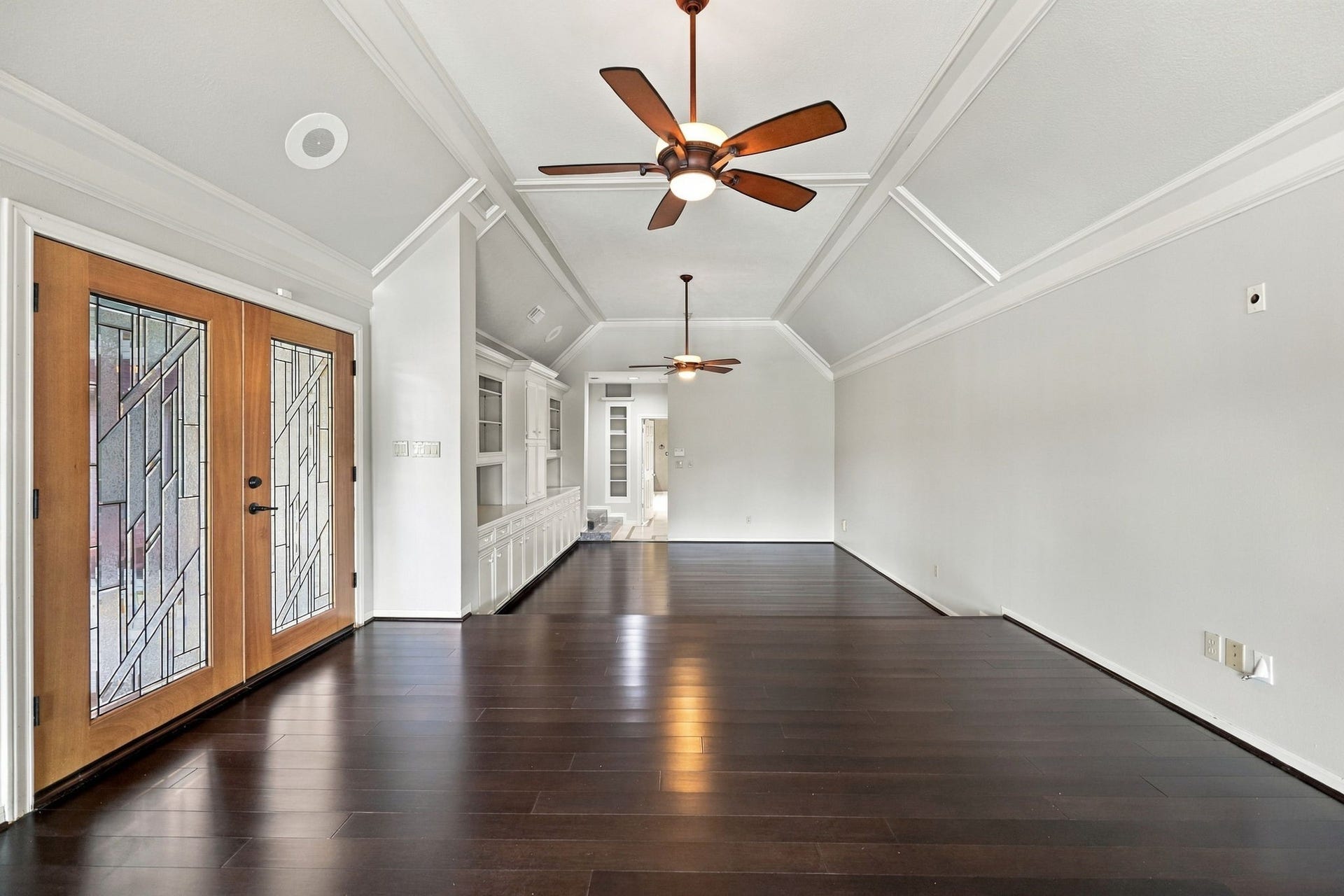 4711 Westerdale Drive, Fulshear, TX 77441 With its generous 15' x 30' dimensions, the Primary Bedroom easily accommodates a king-size bed, bedside tables, and a separate sitting area, offering plenty of room to create your own private retreat while enjoying the beautiful views of Pecan Lake. Double wood/glass doors provide direct access to the Backyard, pool, and spa area, creating a wonderful connection to the home's outdoor living spaces.
