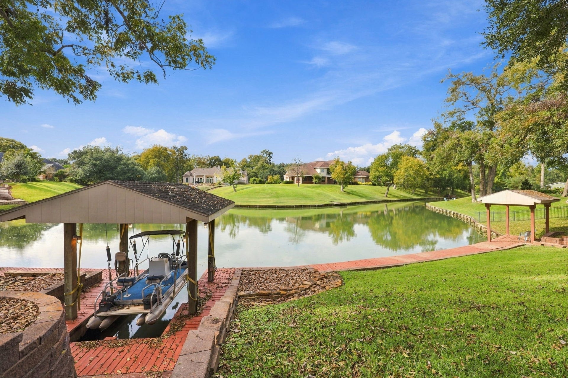 4711 Westerdale Drive, Fulshear, TX 77441 A small pontoon boat with a covered boat lift is included with the property, offering a wonderful opportunity to enjoy leisurely outings on Pecan Lake and take full advantage of the beautiful waterfront setting. Please note: Pecan Lake permits electric motors only. Gasoline-powered or other fuel-operated motors are not allowed.