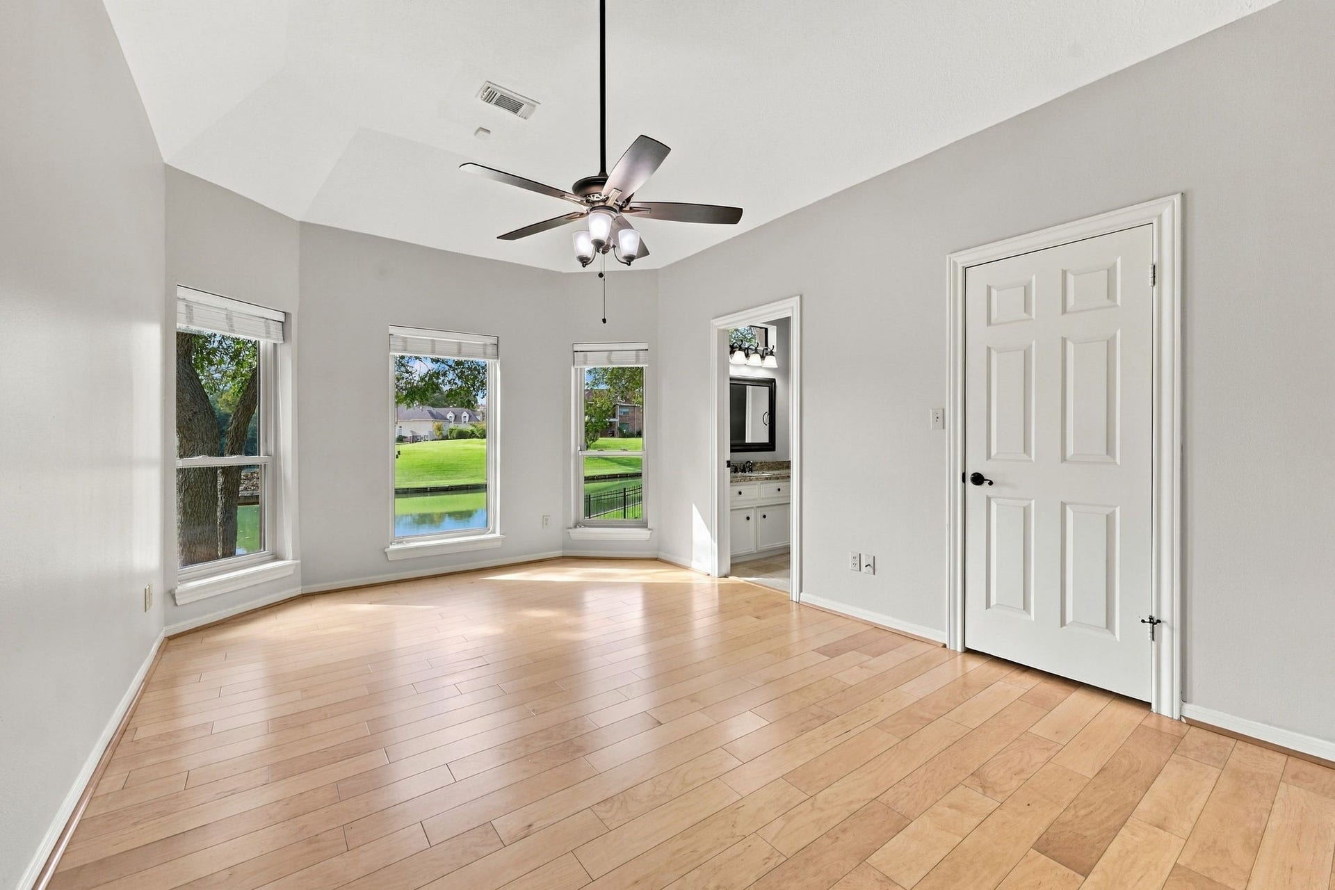 4711 Westerdale Drive, Fulshear, TX 77441 All Secondary Bedrooms are generously sized and feature light wood flooring, walk-in closets with built-ins, and convenient access to a Jack-and-Jill Bathroom. This Bedroom is located at the back of the home and enjoys gorgeous waterfront views, creating a peaceful and picturesque setting.