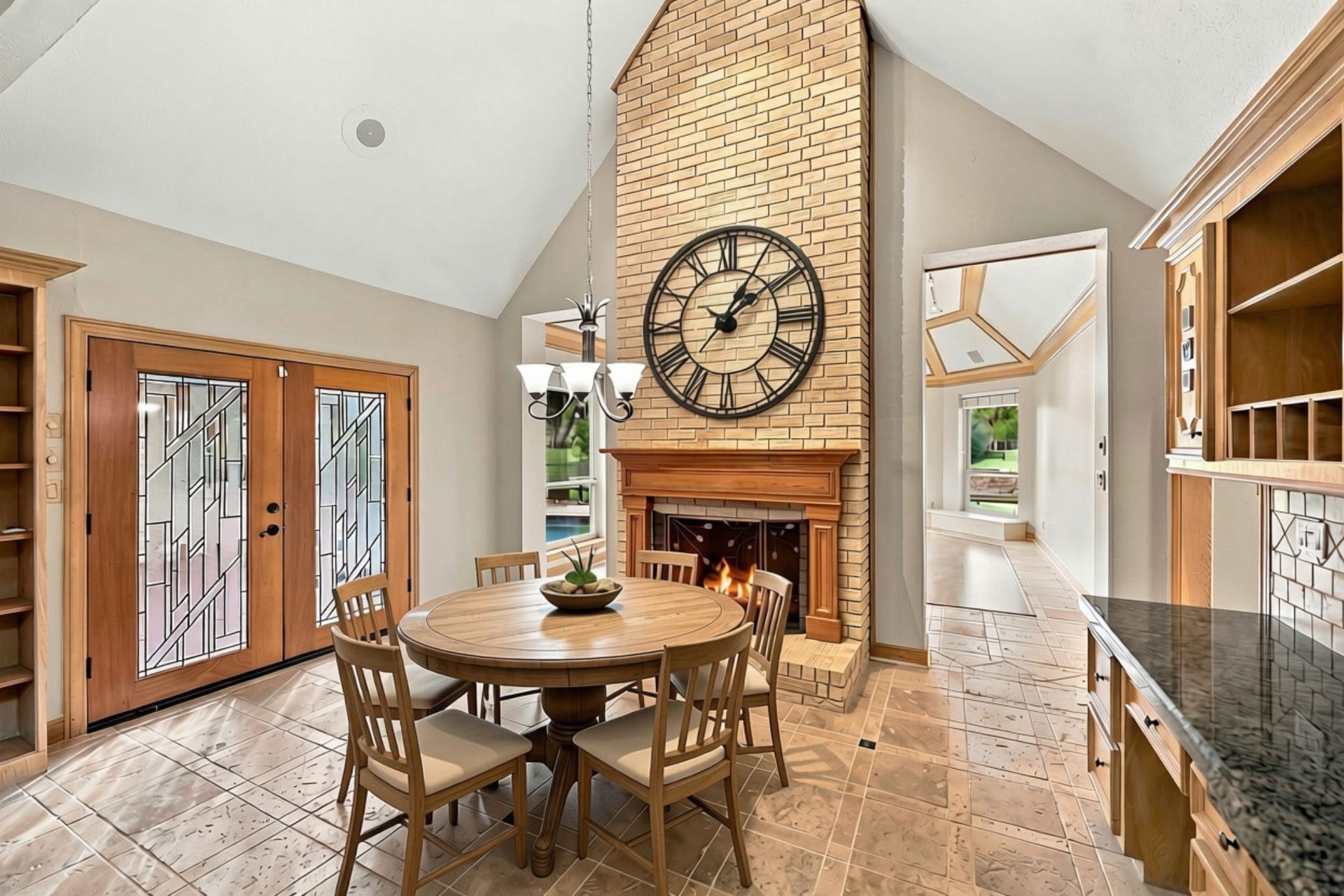 4711 Westerdale Drive, Fulshear, TX 77441 Just off the Breakfast Area, double doors provide convenient access to the back Patio, creating an easy transition between indoor and outdoor living and making it perfect for enjoying morning coffee or entertaining guests. (VIRTUALLY STAGED)
