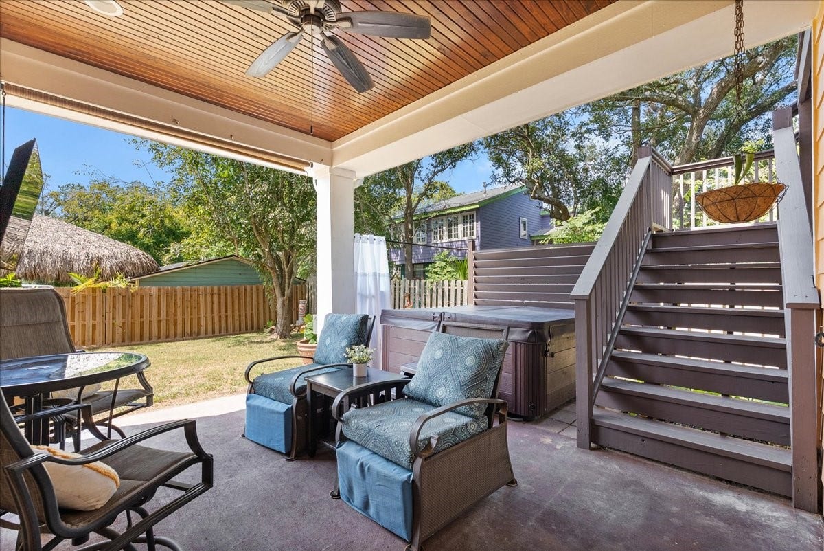 808 Elm Road, Clear Lake Shores, TX 77565 Unwind in the hot tub tucked beneath the covered patio, with a privacy curtain creating a secluded retreat.