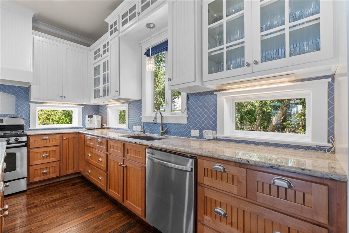 808 Elm Road, Clear Lake Shores, TX 77565 Glass-front cabinetry beautifully showcases your favorite glassware.