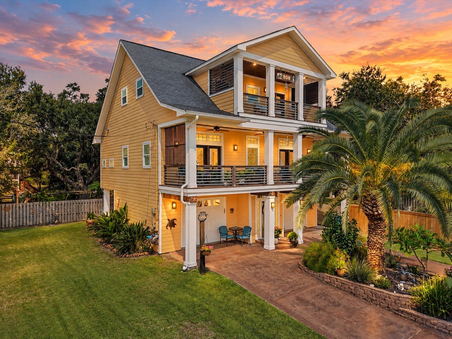 808 Elm Road, Clear Lake Shores, TX 77565 Impressive coastal home with tropical curb appeal and spacious covered balconies.