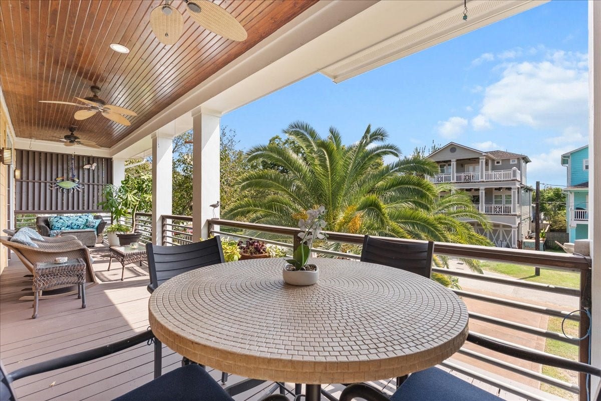 808 Elm Road, Clear Lake Shores, TX 77565 From morning coffee to evening cocktails, this covered balcony invites you to slow down and enjoy living on the Island.