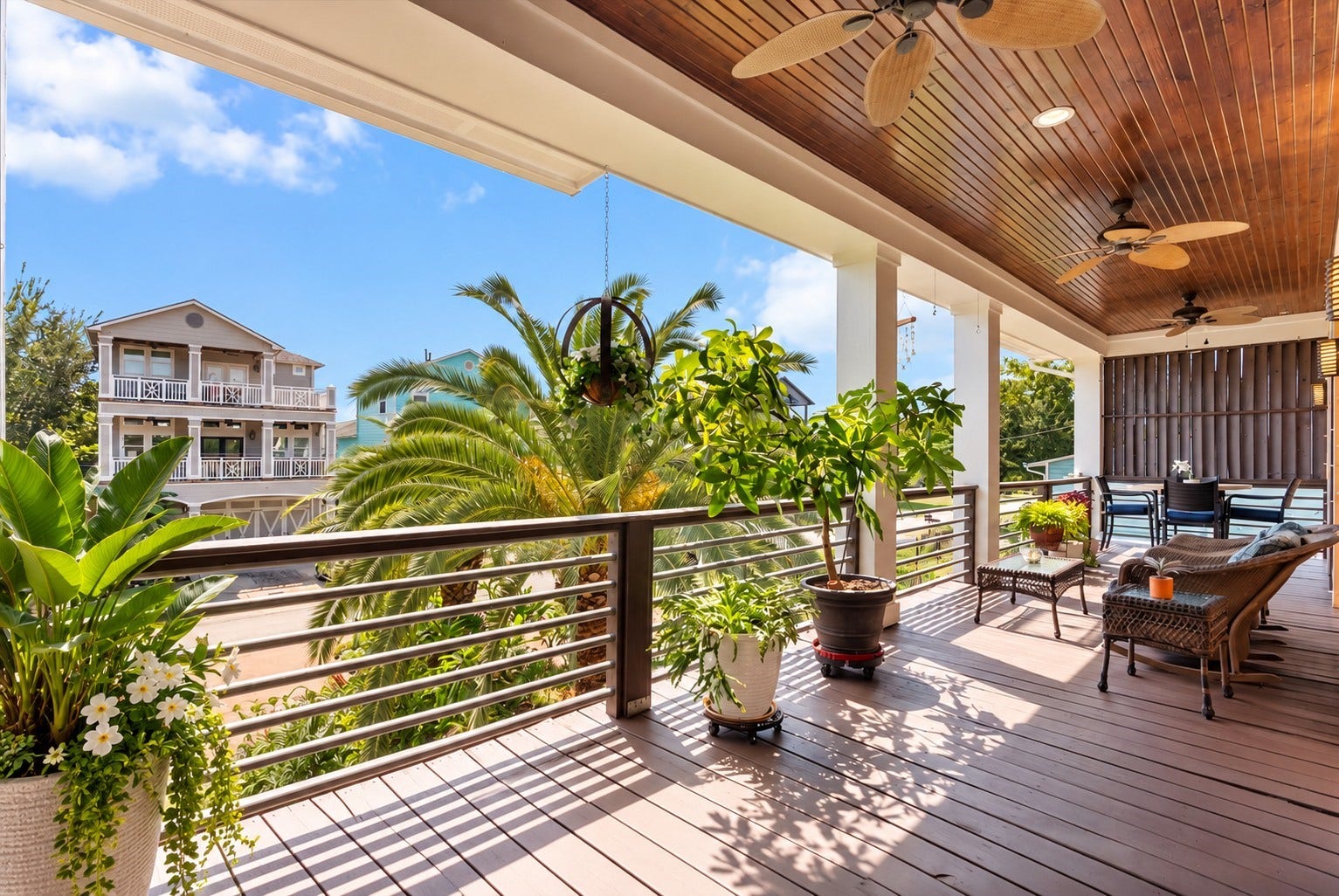 808 Elm Road, Clear Lake Shores, TX 77565 Expansive covered balcony offers a relaxing outdoor living space overlooking the tropical surroundings of Clear Lake Shores.