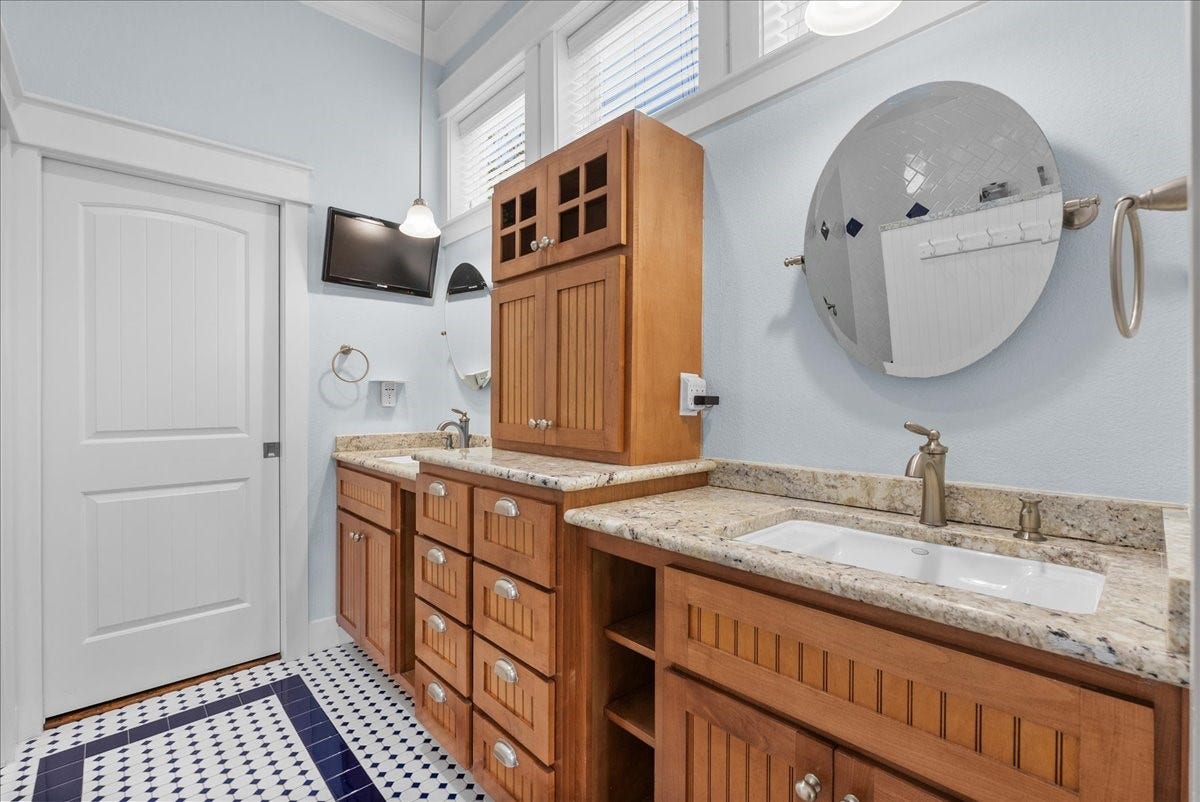 808 Elm Road, Clear Lake Shores, TX 77565 Private en-suite bath complements the spacious primary retreat with walk-in shower and walk-in closet