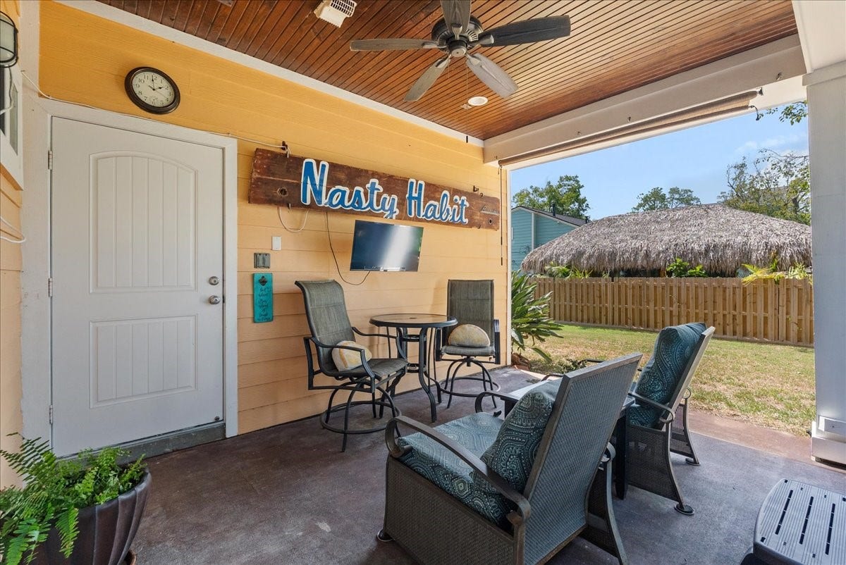 808 Elm Road, Clear Lake Shores, TX 77565 Inviting covered outdoor living areaperfect for relaxing or entertaining, with easy stair access to the kitchen.