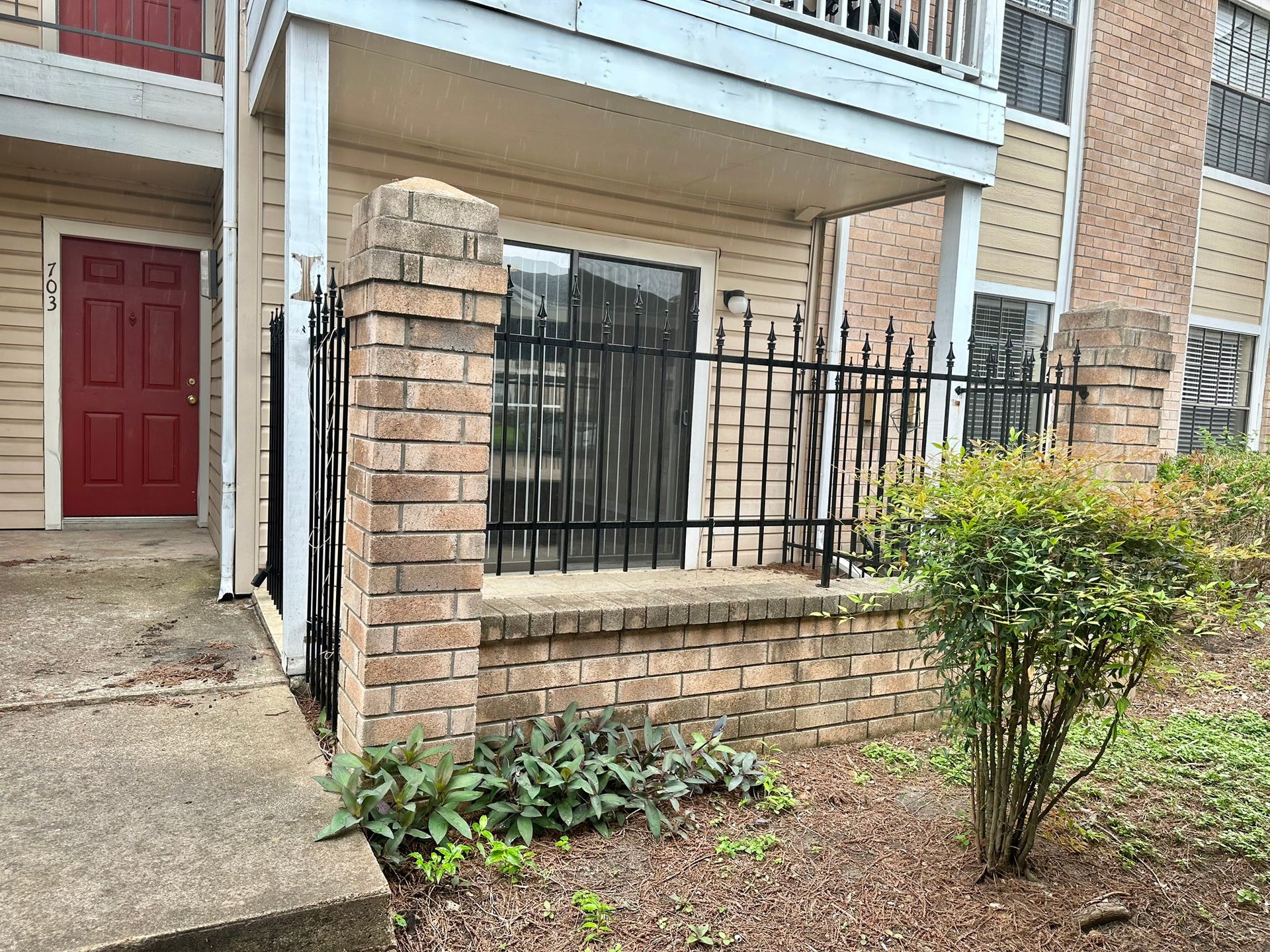 2750 Holly Hall Street, #703, Houston, TX 77054 Front view with fenced patio area.