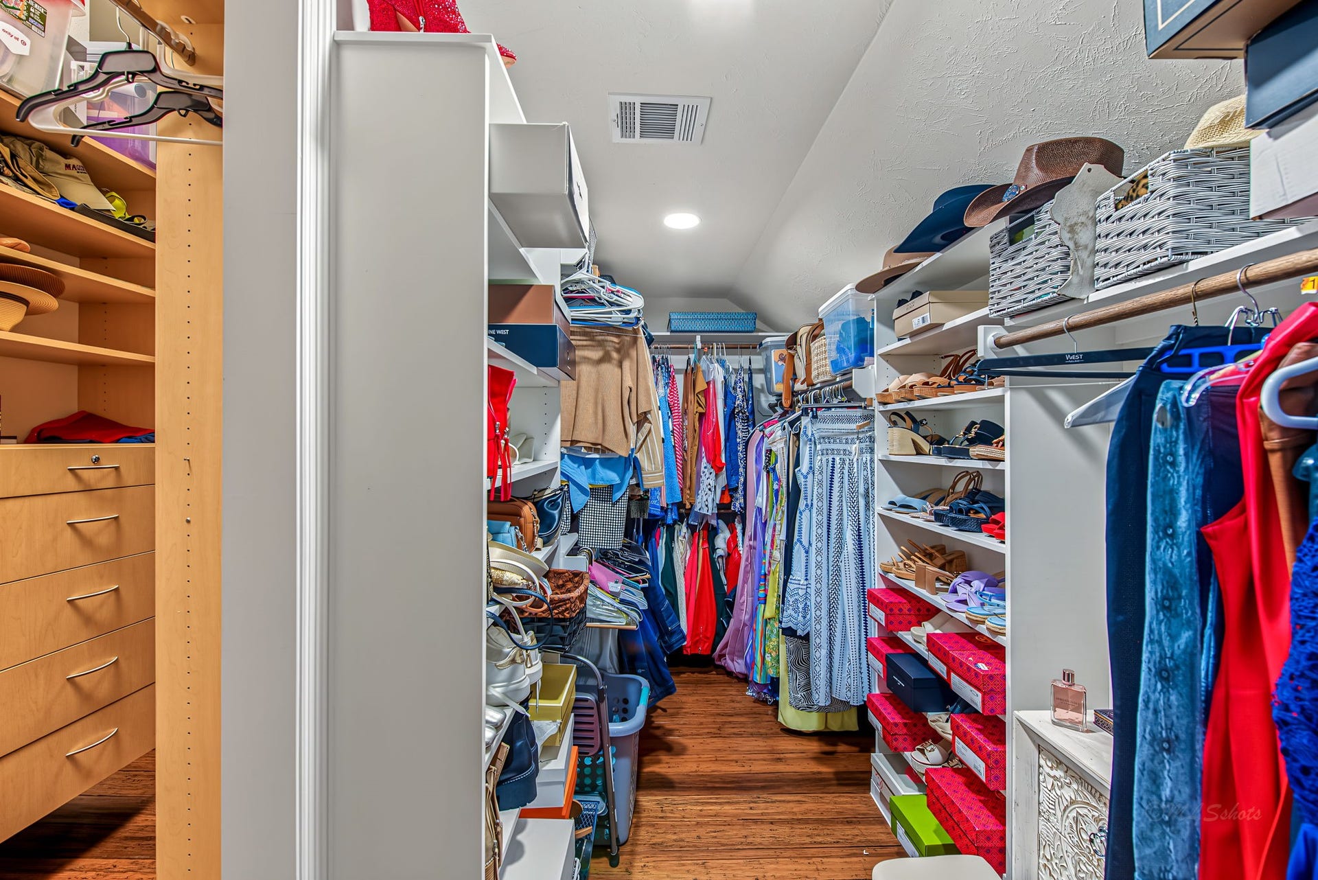 21223 Dover Park Lane, Katy, TX 77450 Spacious walk-in closet featuring custom shelving, ample hanging space, and organized shoe storage.