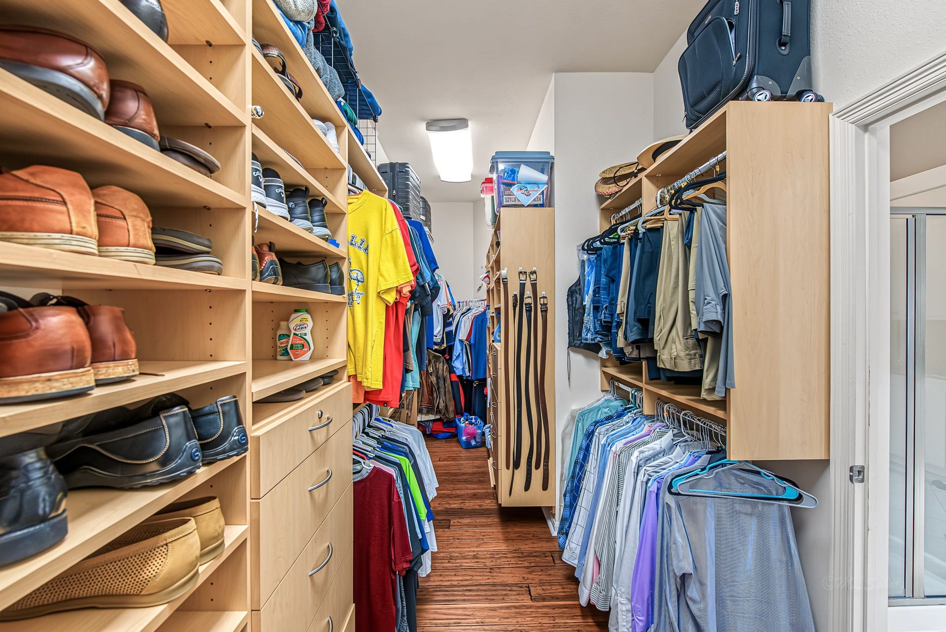 21223 Dover Park Lane, Katy, TX 77450 Spacious walk-in closet featuring custom shelving, ample hanging space, and organized shoe storage.