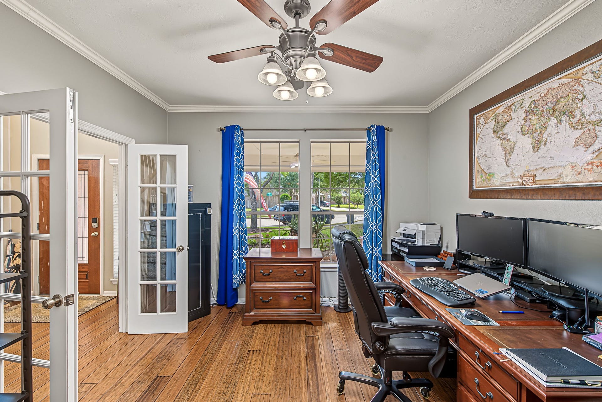 21223 Dover Park Lane, Katy, TX 77450 Bright and inviting home office featuring French doors, elegant wood flooring, and a large window offering ample natural light.
