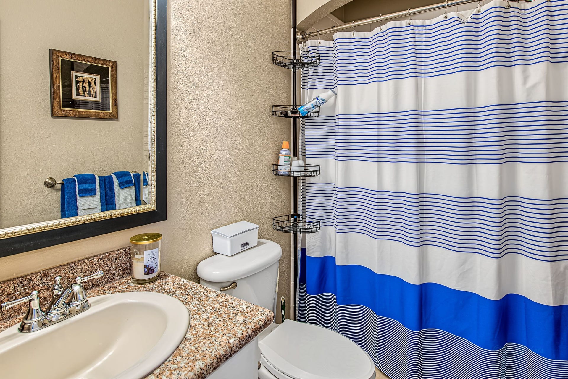 21223 Dover Park Lane, Katy, TX 77450 Charming bathroom featuring a granite countertop, modern fixtures, and a stylish striped shower curtain.