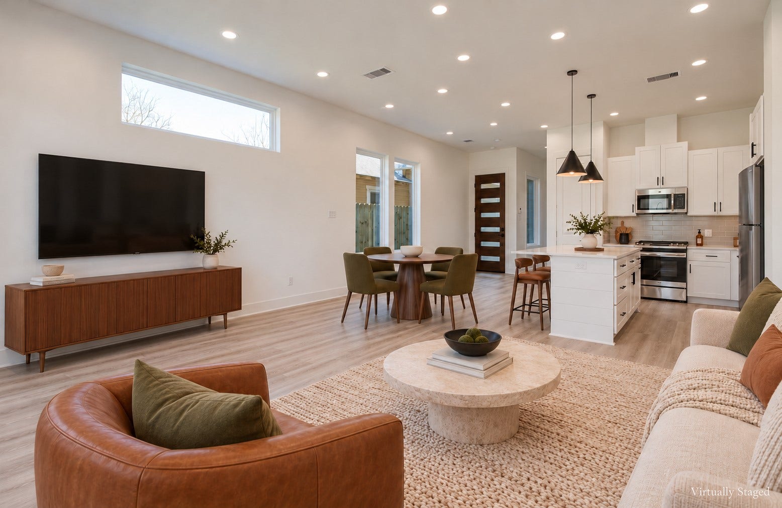 4425 Providence Street, Houston, TX 77020 Generous living and dining space lets you arrange the home around the way you live, whether that means hosting a full table or stretching out for a quiet evening. Virtually staged.