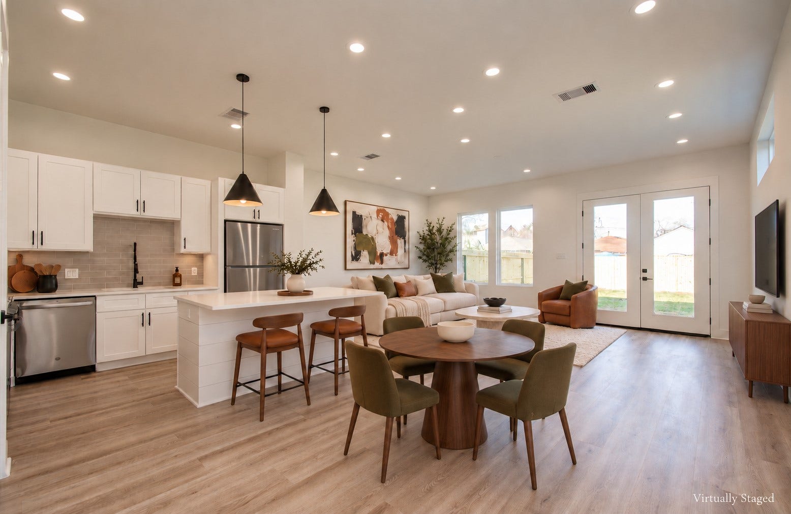 4425 Providence Street, Houston, TX 77020 This two-story layout puts the kitchen, dining and living areas on the first floor, with French doors opening directly to your private backyard. Groceries, dinner parties and evenings outside all happen on the same level. Virtually staged.