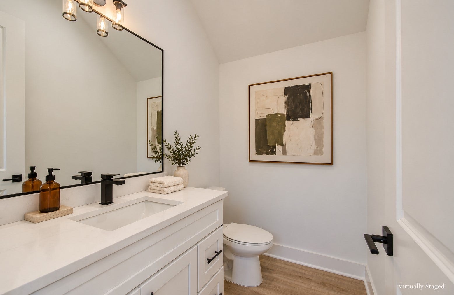 4425 Providence Street, Houston, TX 77020 A half bath on the first floor keeps entertaining convenient and gives guests what they need without sending them upstairs to the bedroom level. Virtually staged.
