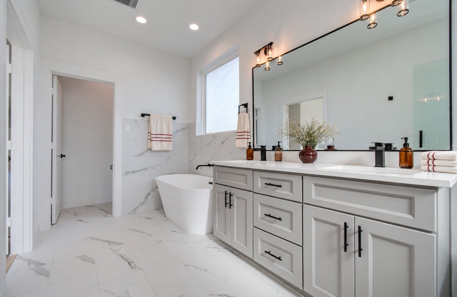 4425 Providence Street, Houston, TX 77020 A wide double vanity gives you room to spread out and get ready comfortably, with storage below to keep everyday essentials close at hand. Virtually staged.