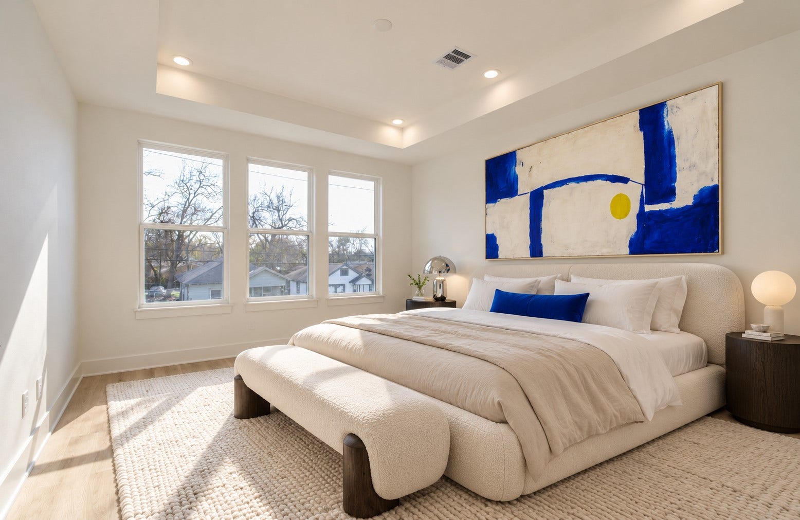4425 Providence Street, Houston, TX 77020 Three tall windows and a tray ceiling give the spacious primary bedroom an airy feel, with natural light that makes the room inviting well beyond bedtime. Virtually staged.