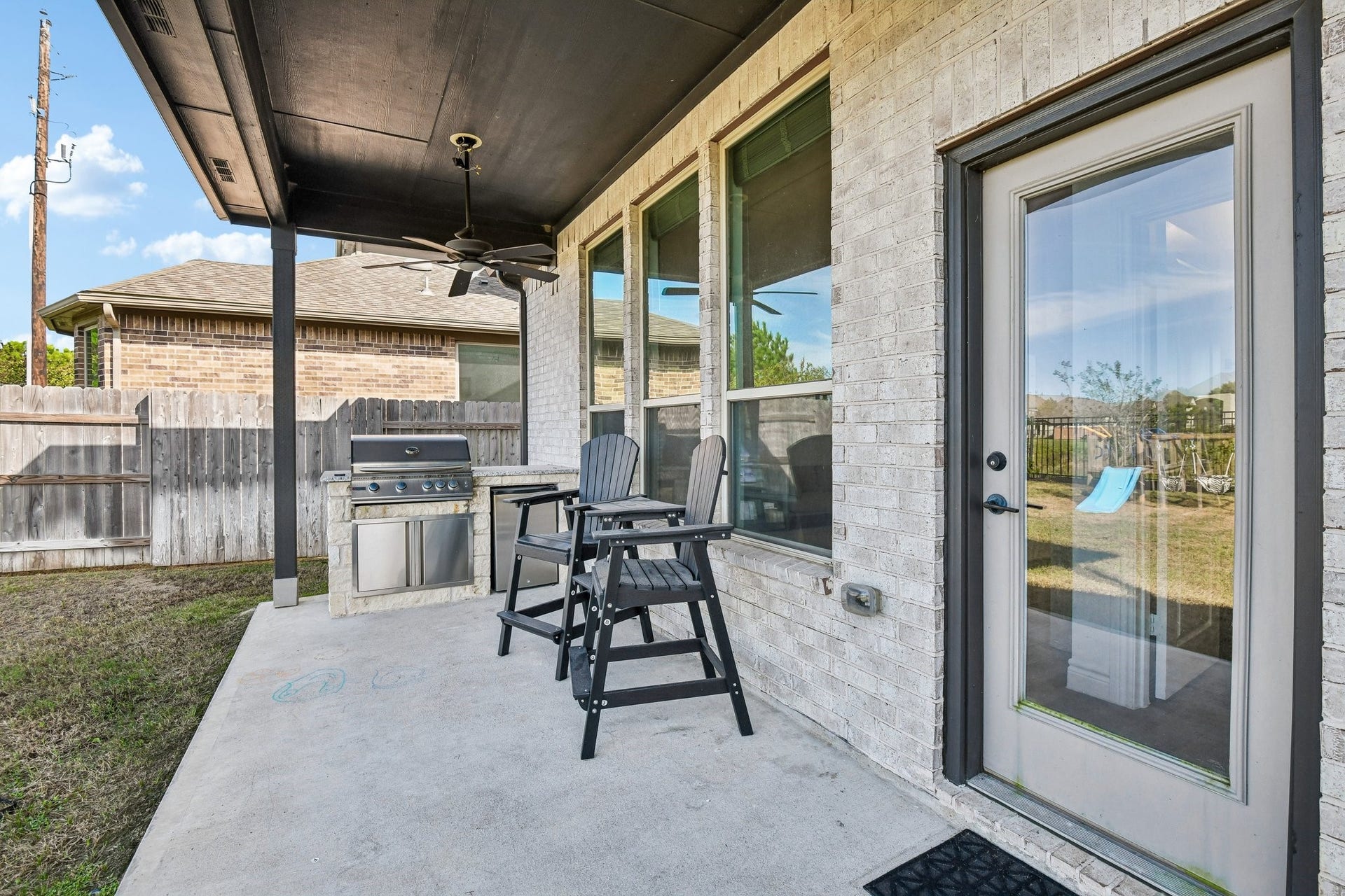 24110 Hawthorn Breeze Way, Katy, TX 77493 Covered patio with built-in grill and room for outdoor dining or lounge seating