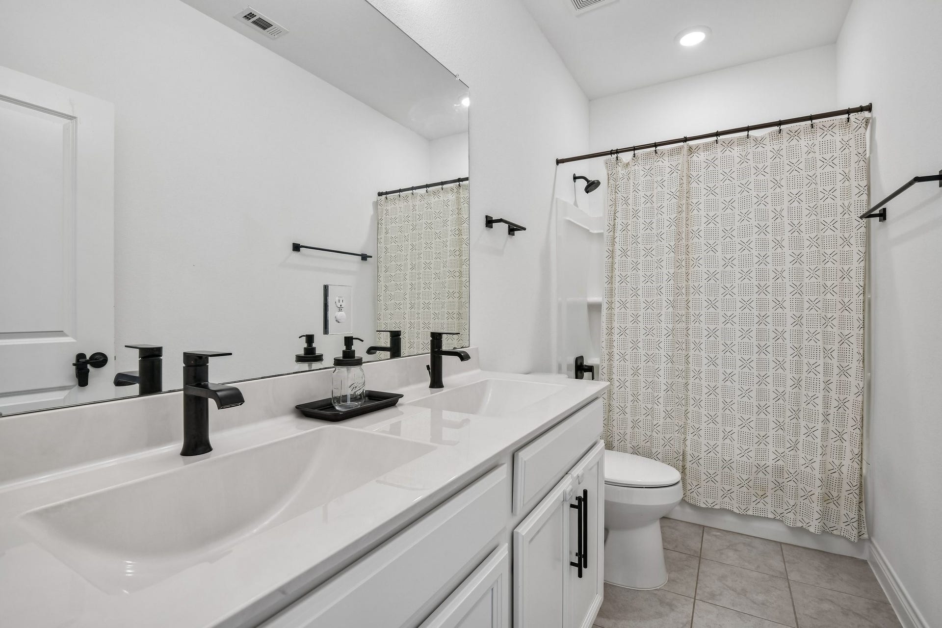 24110 Hawthorn Breeze Way, Katy, TX 77493 Secondary bath with dual sink vanity, ample counter space, and neutral finishes