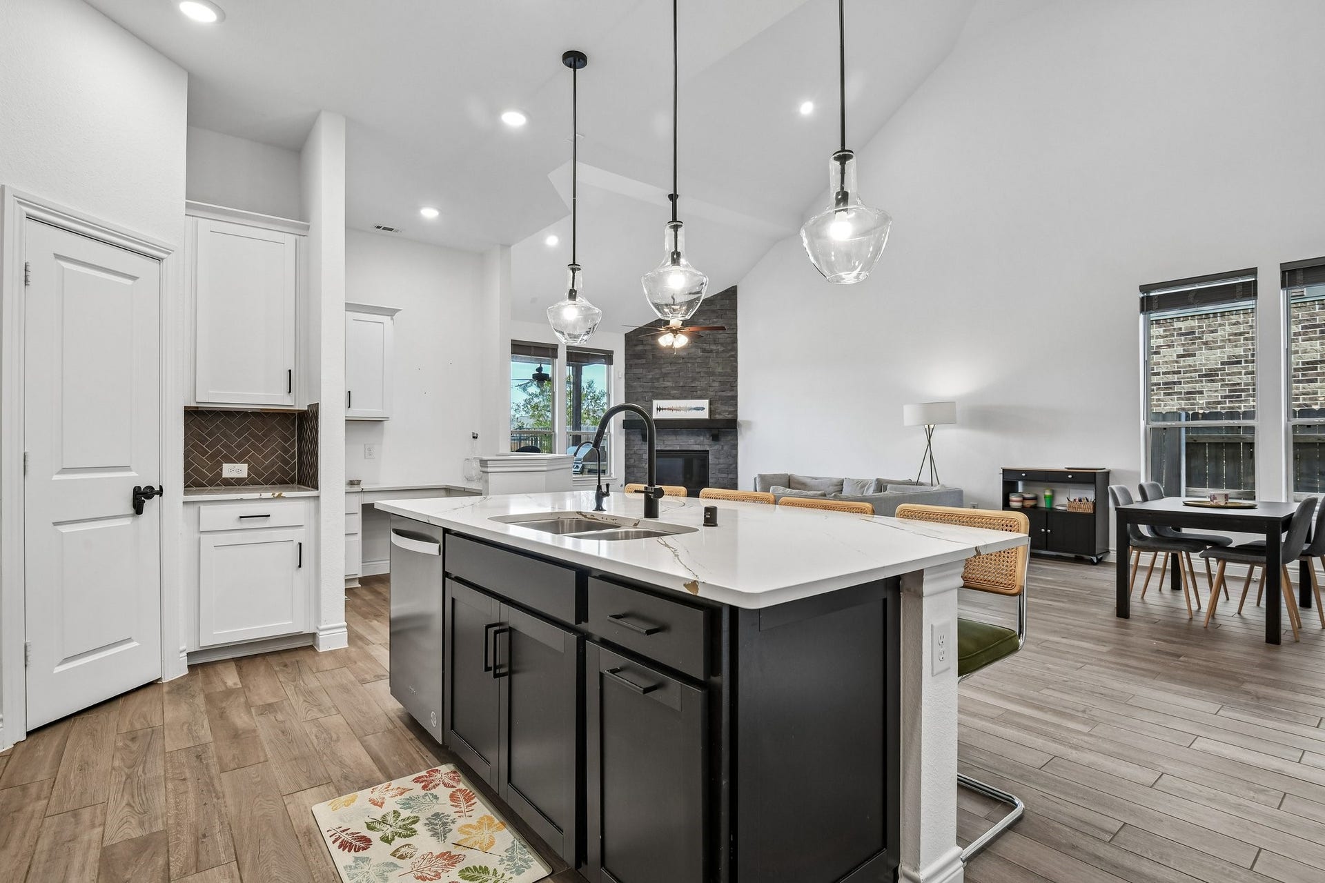24110 Hawthorn Breeze Way, Katy, TX 77493 Large quartz island provides seating, storage, and a central gathering point for the home