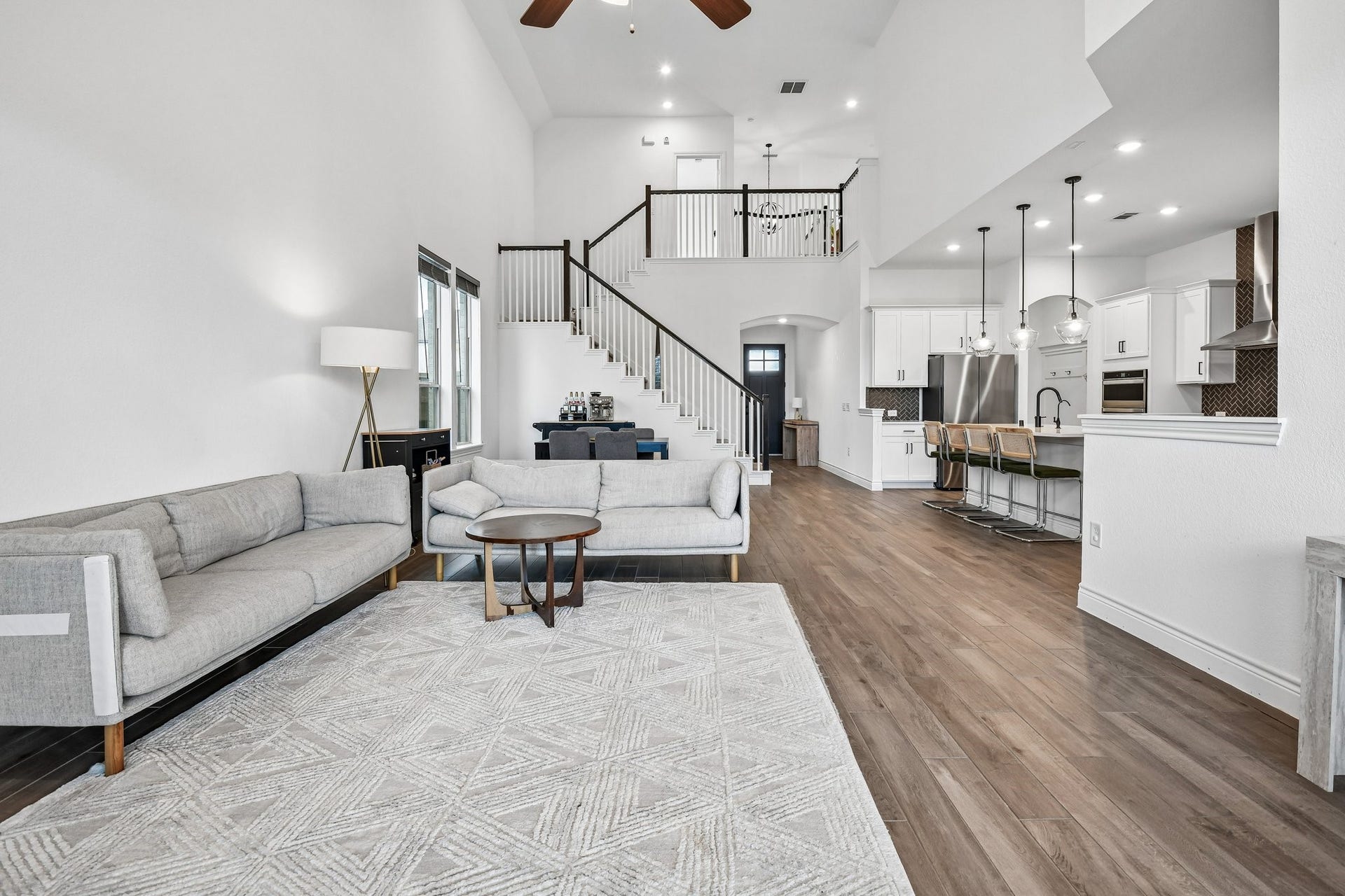 24110 Hawthorn Breeze Way, Katy, TX 77493 Two-story family room opens to the kitchen and dining space for an uninterrupted main-level layout