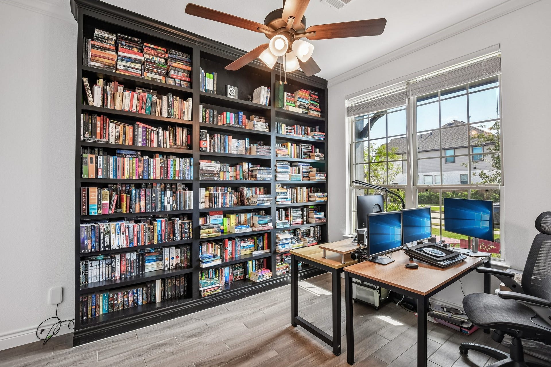 24110 Hawthorn Breeze Way, Katy, TX 77493 Private study off the entry with built-in shelving, natural light, and room for a full workspace