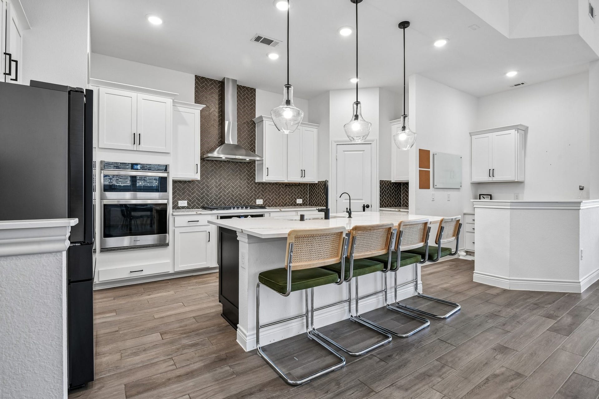24110 Hawthorn Breeze Way, Katy, TX 77493 Kitchen view across the quartz island toward the family room and dining area