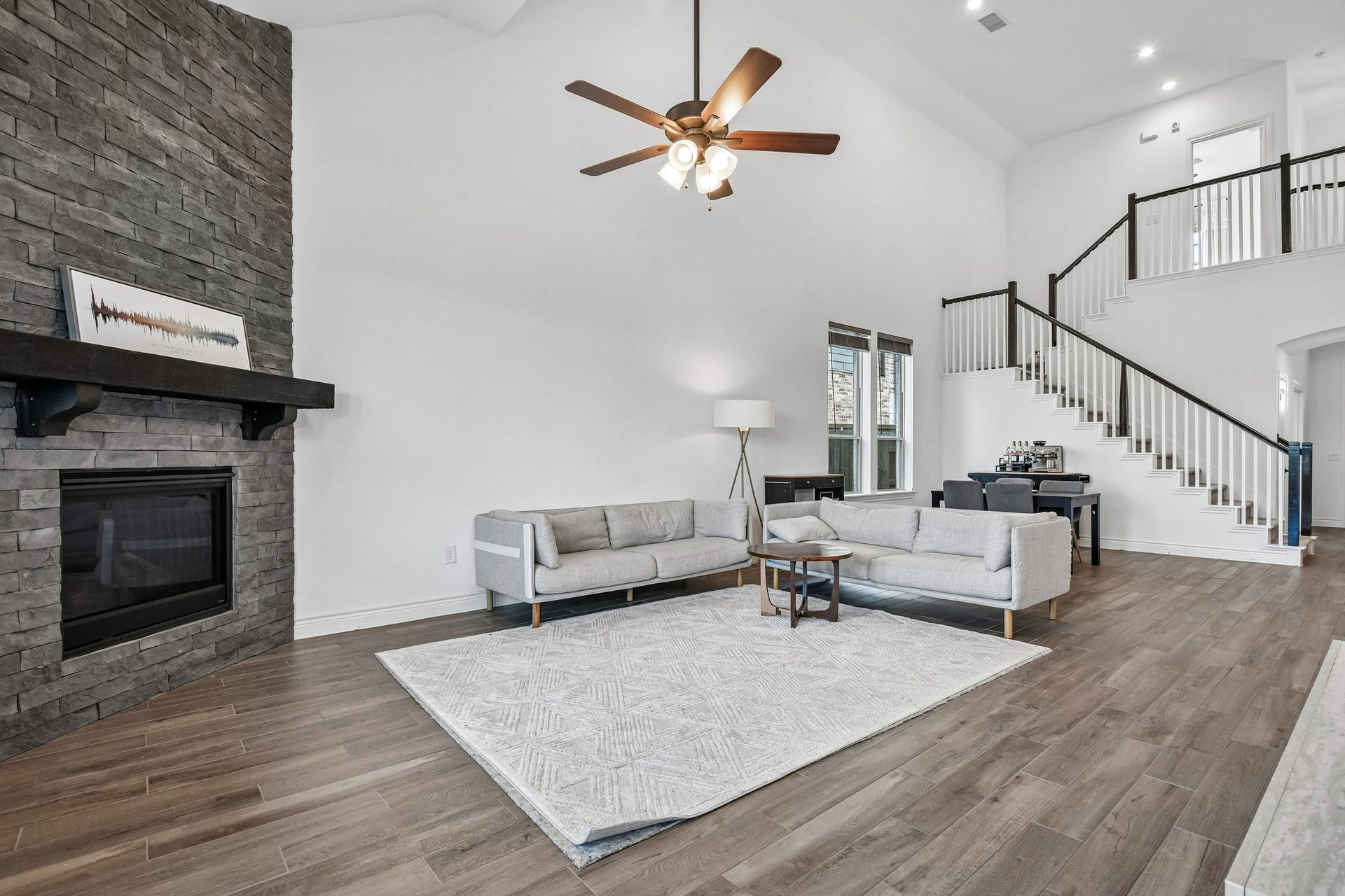24110 Hawthorn Breeze Way, Katy, TX 77493 Second family room angle showing the open railing, tall ceilings, and connection to the kitchen