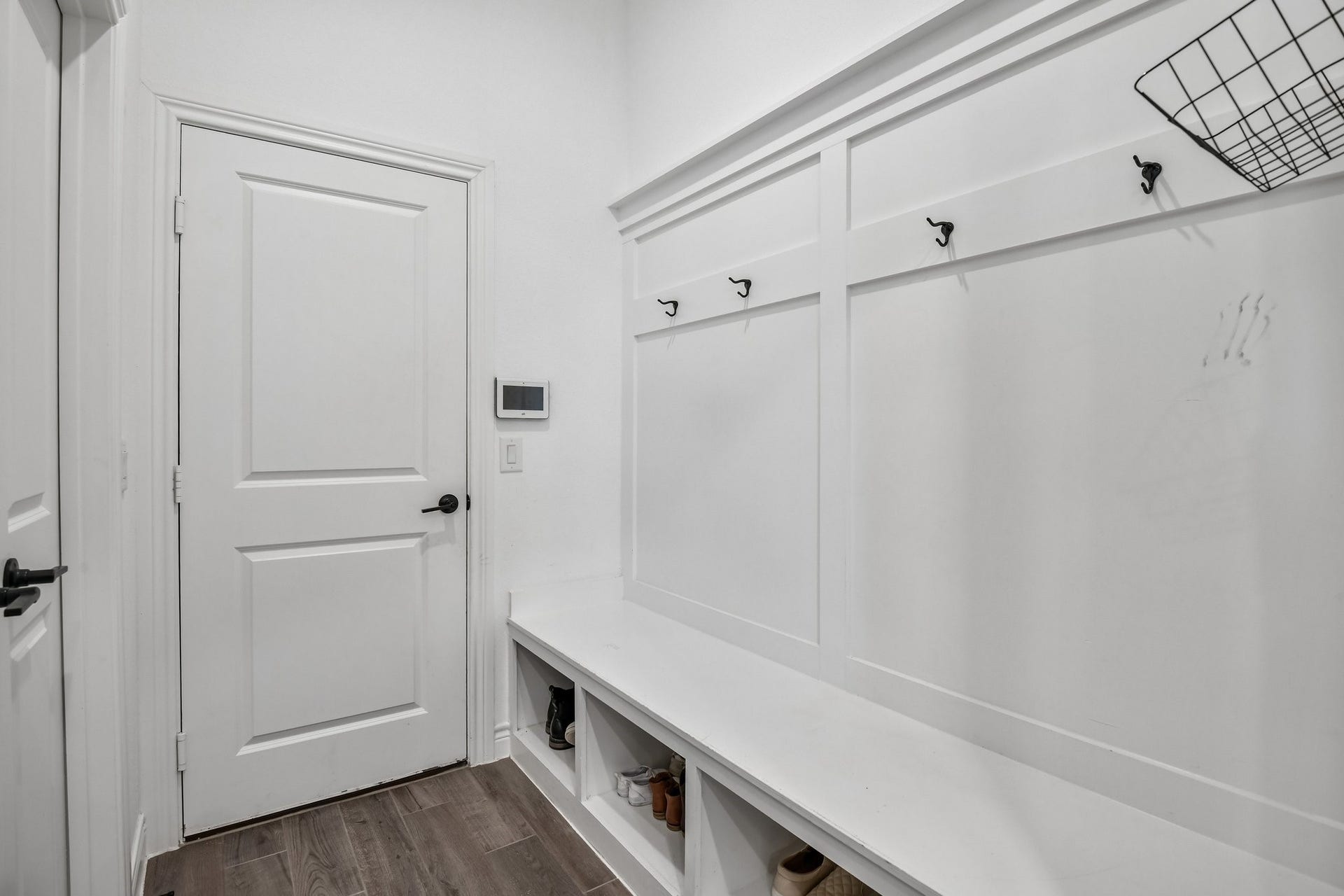 24110 Hawthorn Breeze Way, Katy, TX 77493 Mudroom drop zone with built-in bench, hooks, and convenient access to the laundry room and garage