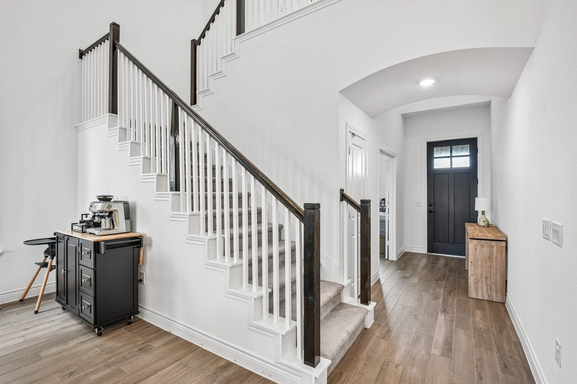 24110 Hawthorn Breeze Way, Katy, TX 77493 Open rail staircase overlooks the two-story family room and connects the upper and lower levels