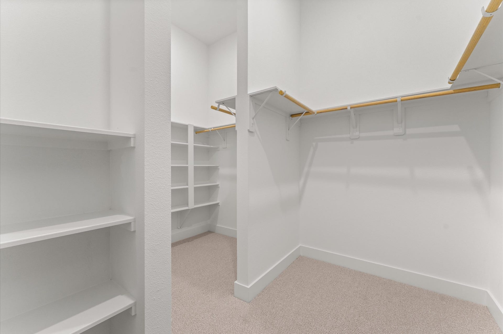 1009 Tuskegee Heights Lane, Houston, TX 77091 This expansive walk-in closet is a standout feature of the primary bedroom, offering generous space for wardrobe organization and personal storage. Thoughtfully designed shelving and hanging rods, the closet provides a boutique-like experience with room for everything from seasonal clothing to accessories.