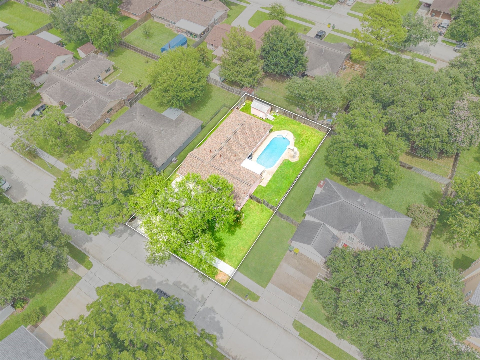 2309 Halbert Drive, Pearland, TX 77581 This aerial view highlights the spacious, fully fenced backyard, showcasing the ample outdoor space and privacy the property offers.