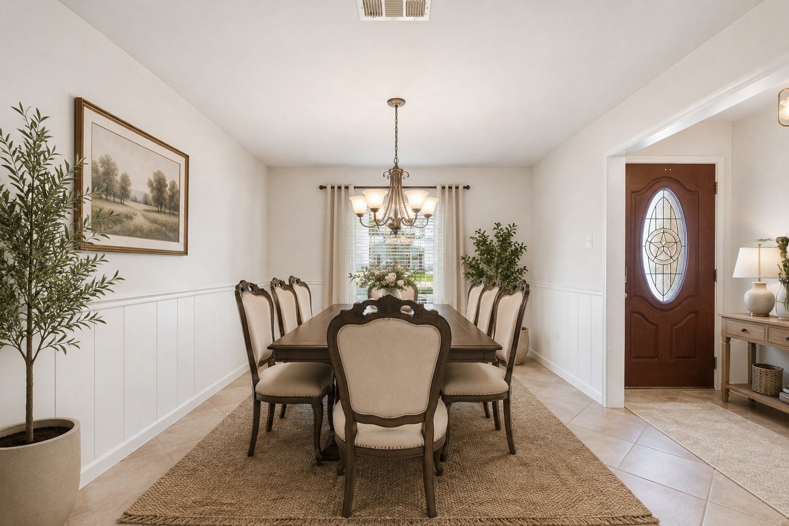 2309 Halbert Drive, Pearland, TX 77581 The dining room features a large window with privacy blinds, a classic chandelier and tile flooring, creating a refined and inviting space ideal for hosting and entertaining. *Virtually staged