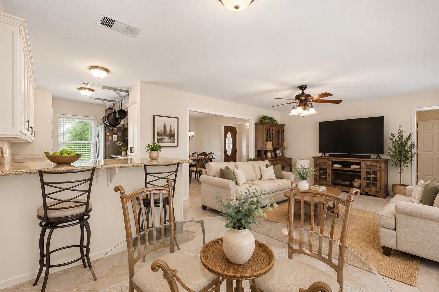 2309 Halbert Drive, Pearland, TX 77581 The living room boasts a modern ceiling fan, large windows that brighten the space, and tile flooring the perfect blend of style, comfort, and functionality. This open floor plan creates a seamless flow between living spaces, making entertaining effortless and enjoyable.