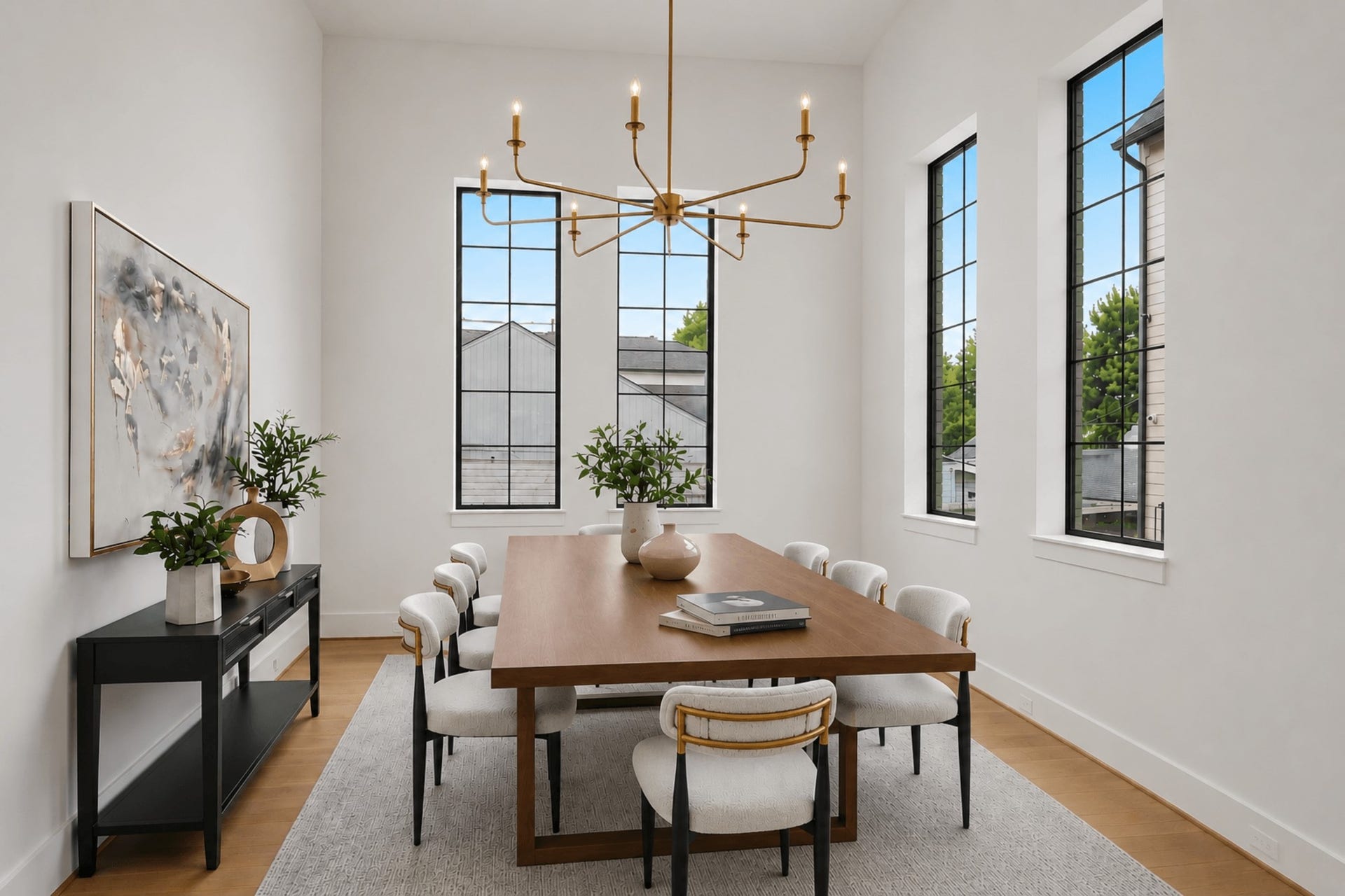 705 Walton Street, Houston, TX 77009 Elegant dining room with soaring ceilings, abundant natural light from tall windows, and custom lighting.