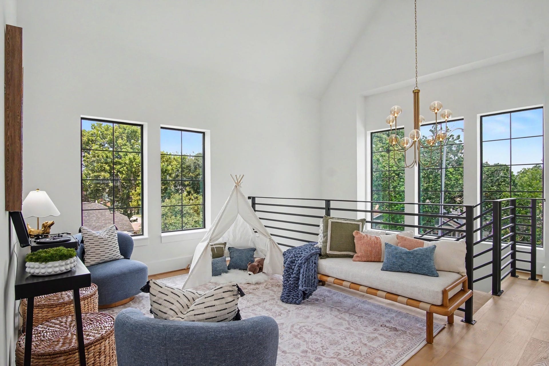 705 Walton Street, Houston, TX 77009 Bright and airy lofted flex space with large windows and cozy seating.