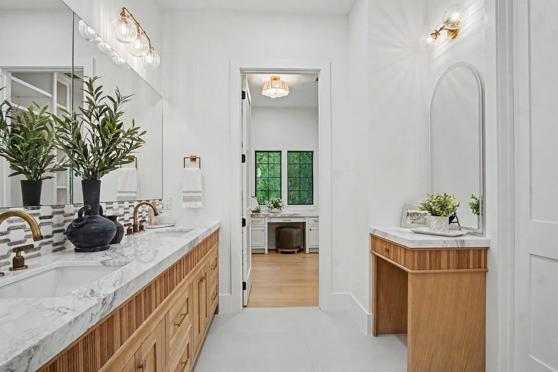 705 Walton Street, Houston, TX 77009 Double vanities in this primary bathroom and attached closet.