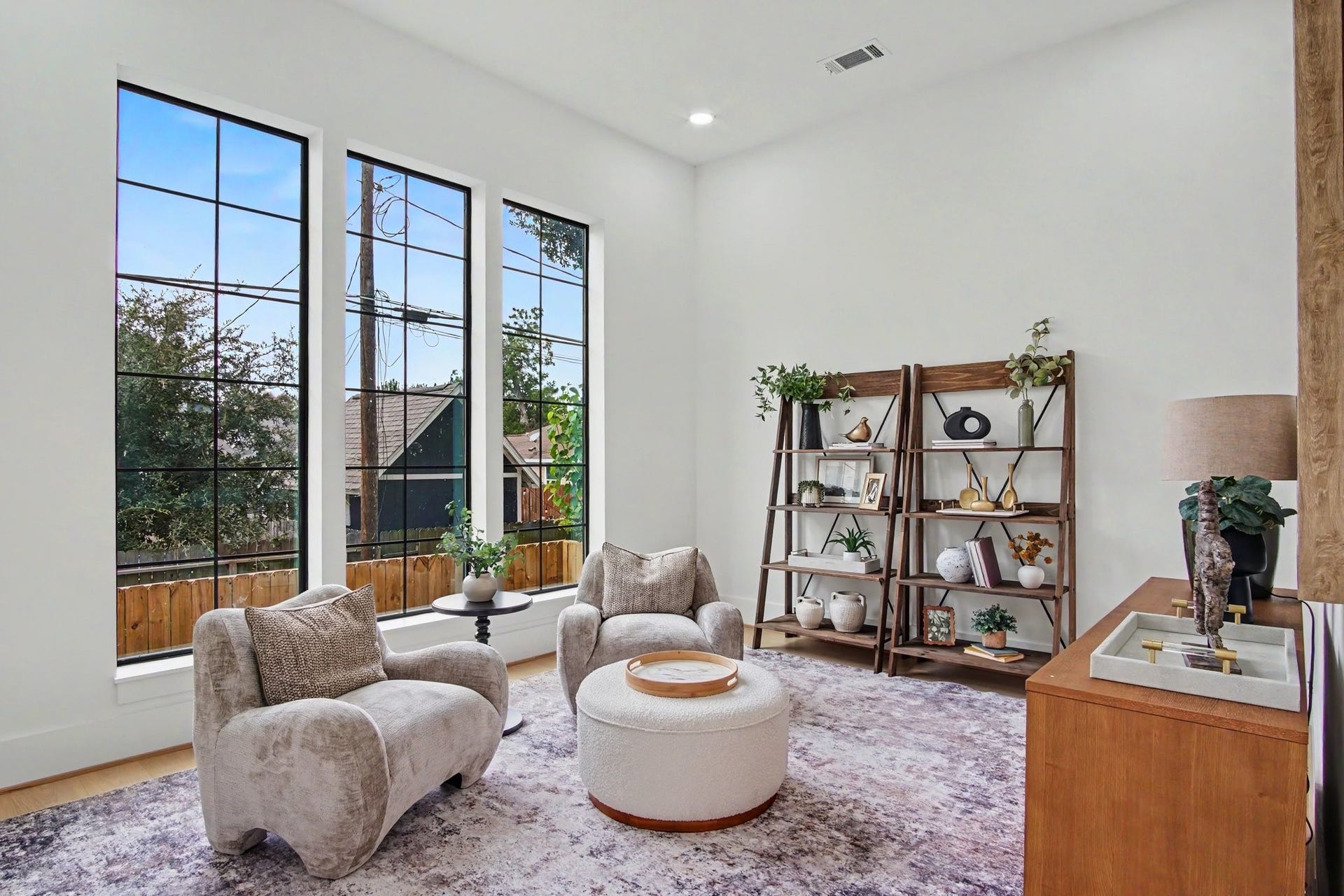 705 Walton Street, Houston, TX 77009 Bright and inviting flex area featuring expansive windows, perfect for a game room, play room, or secondary home office.