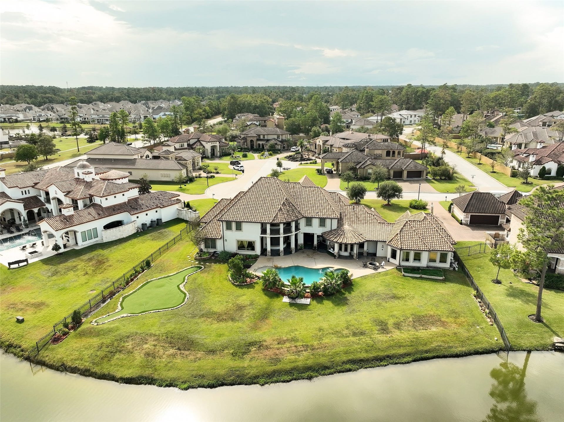In addition to the large pool and private putting green, property includes plenty of additional green space for pets and play in the back yard.