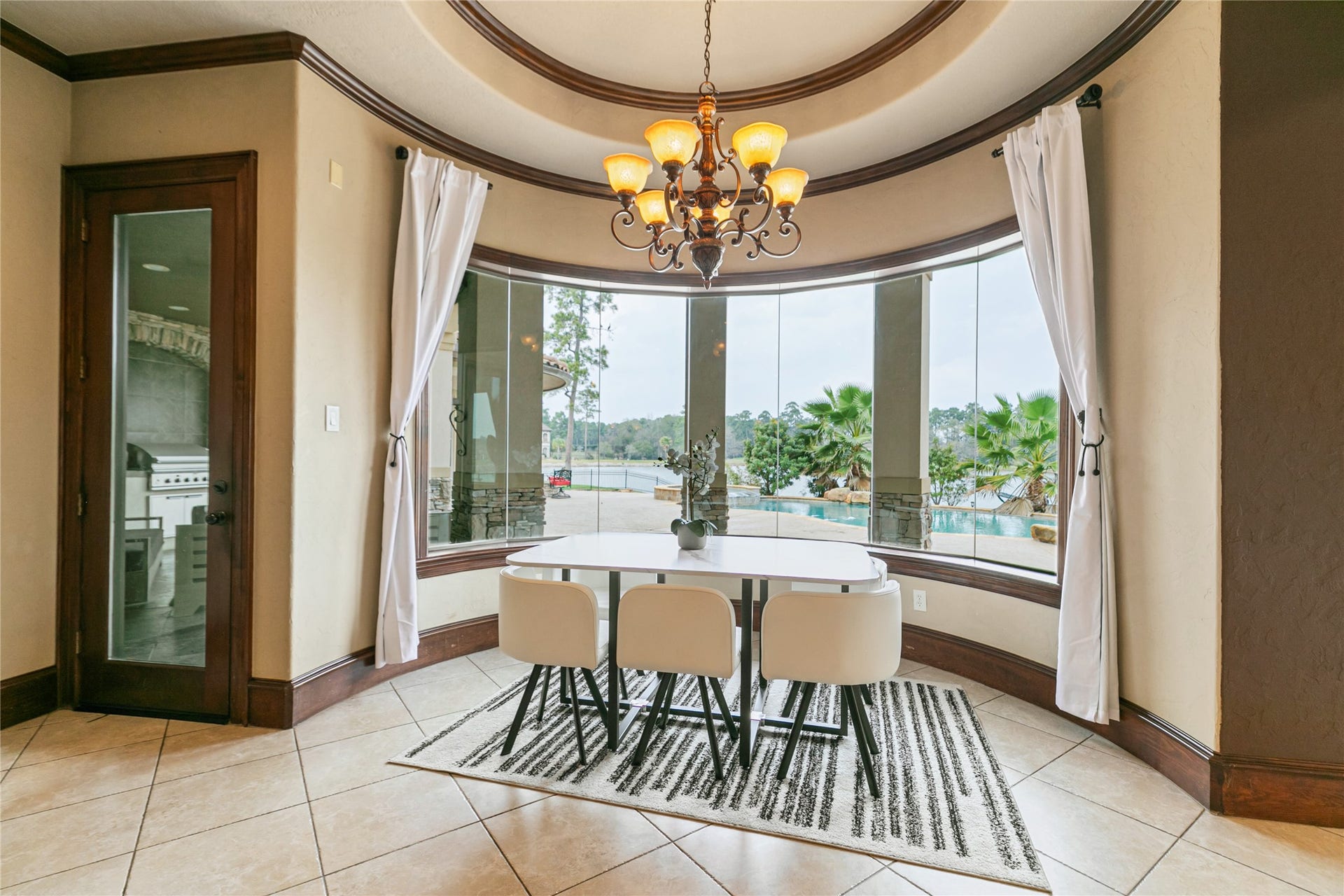 Bright breakfast area featuring stunning views of the back yard.