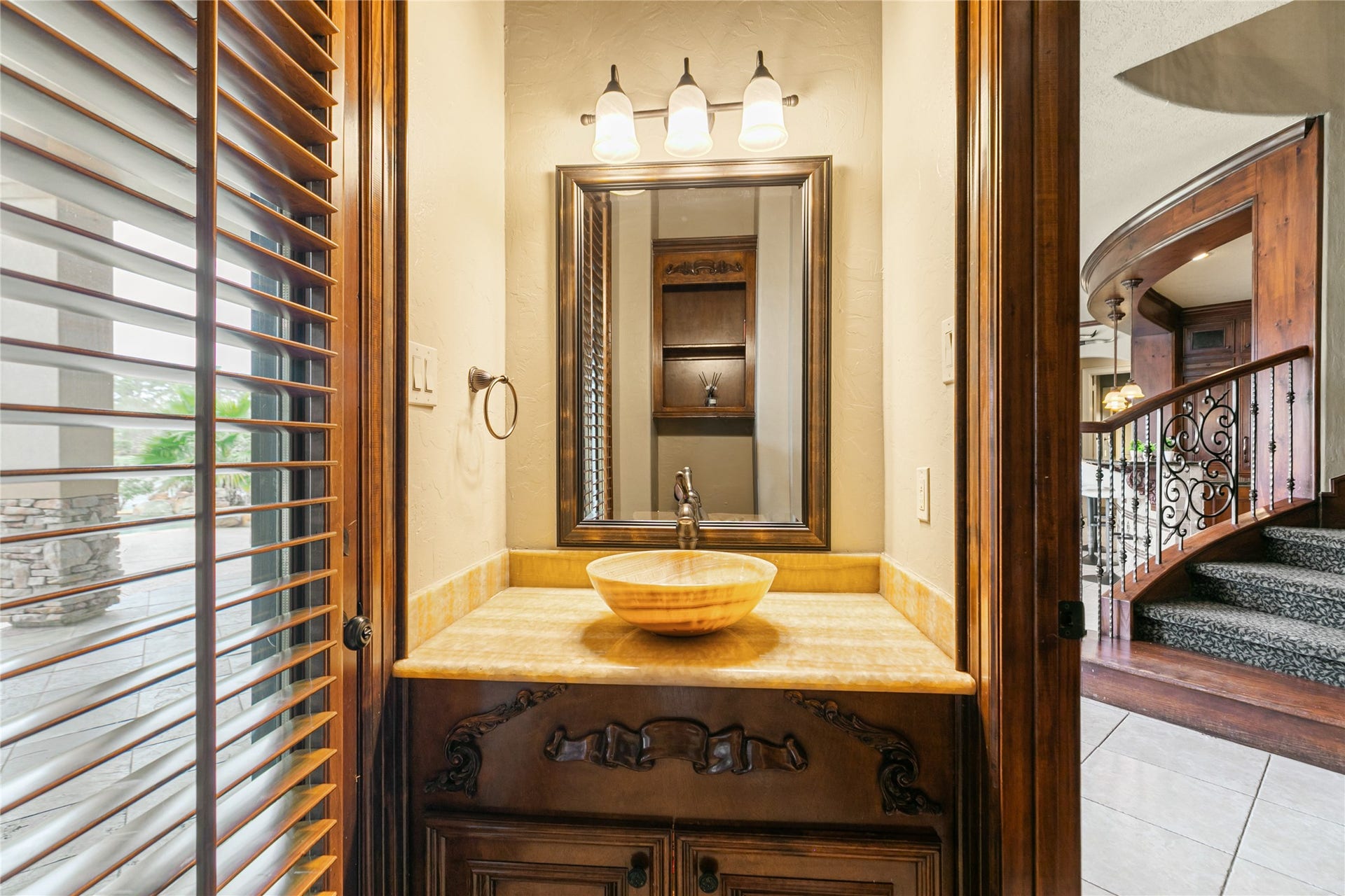 Attractive half bath with easy access to back patio/pool.