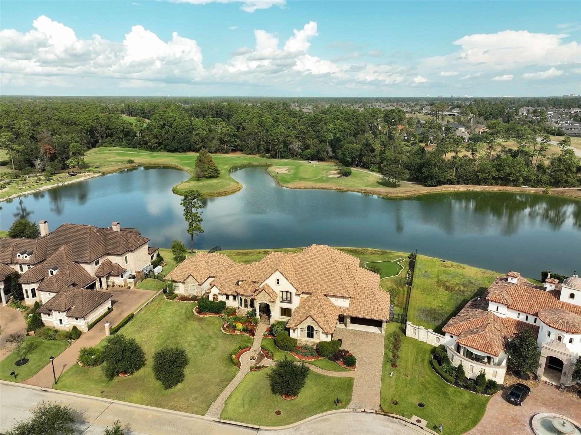 Another aerial view of the home showcasing its stunning surroundings.