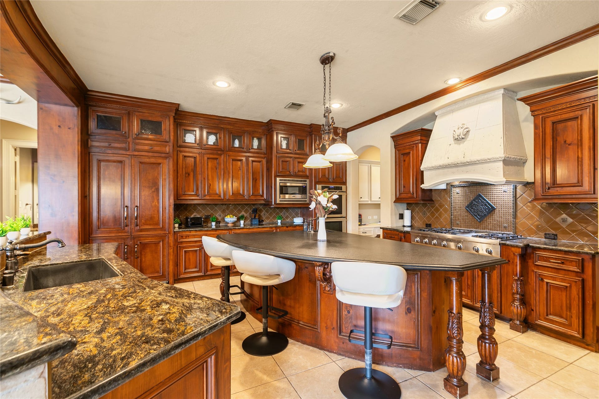 Large island in the center of this spacious kitchen creates a fabulous space for gathering.