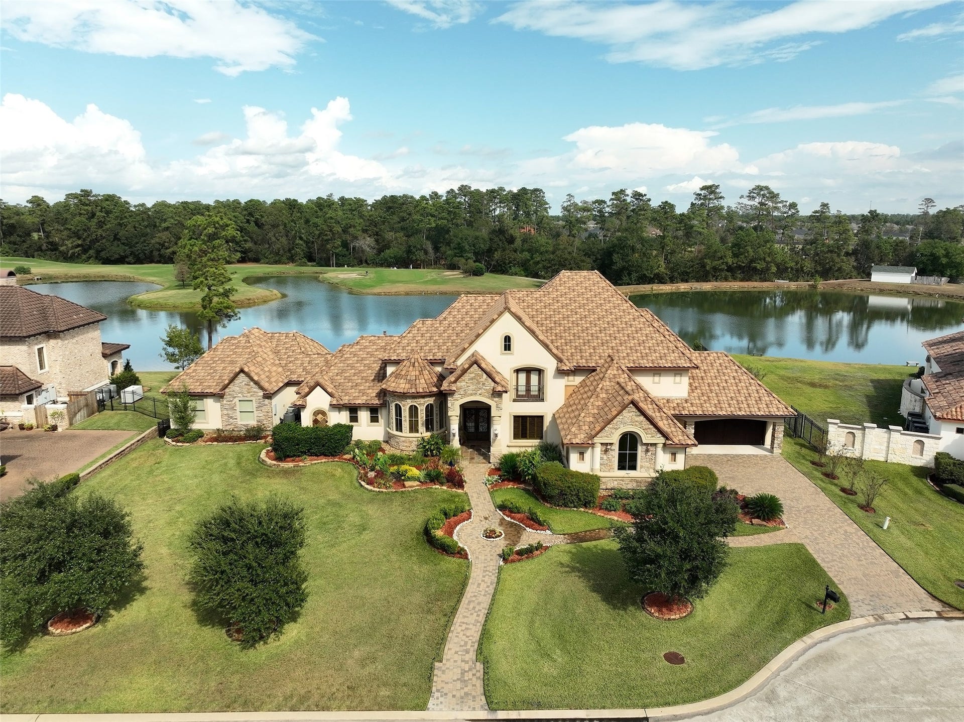Luxury living on a beautiful lake on Augusta Pines Golf Course.