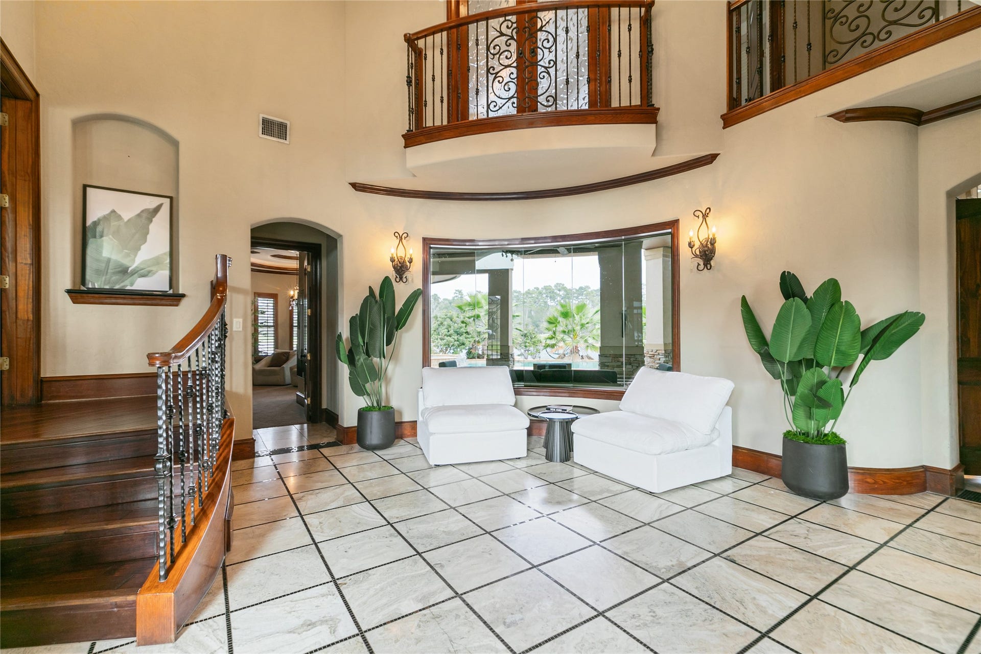 Another view of front entrance highlighted by large windows overlooking the back yard.