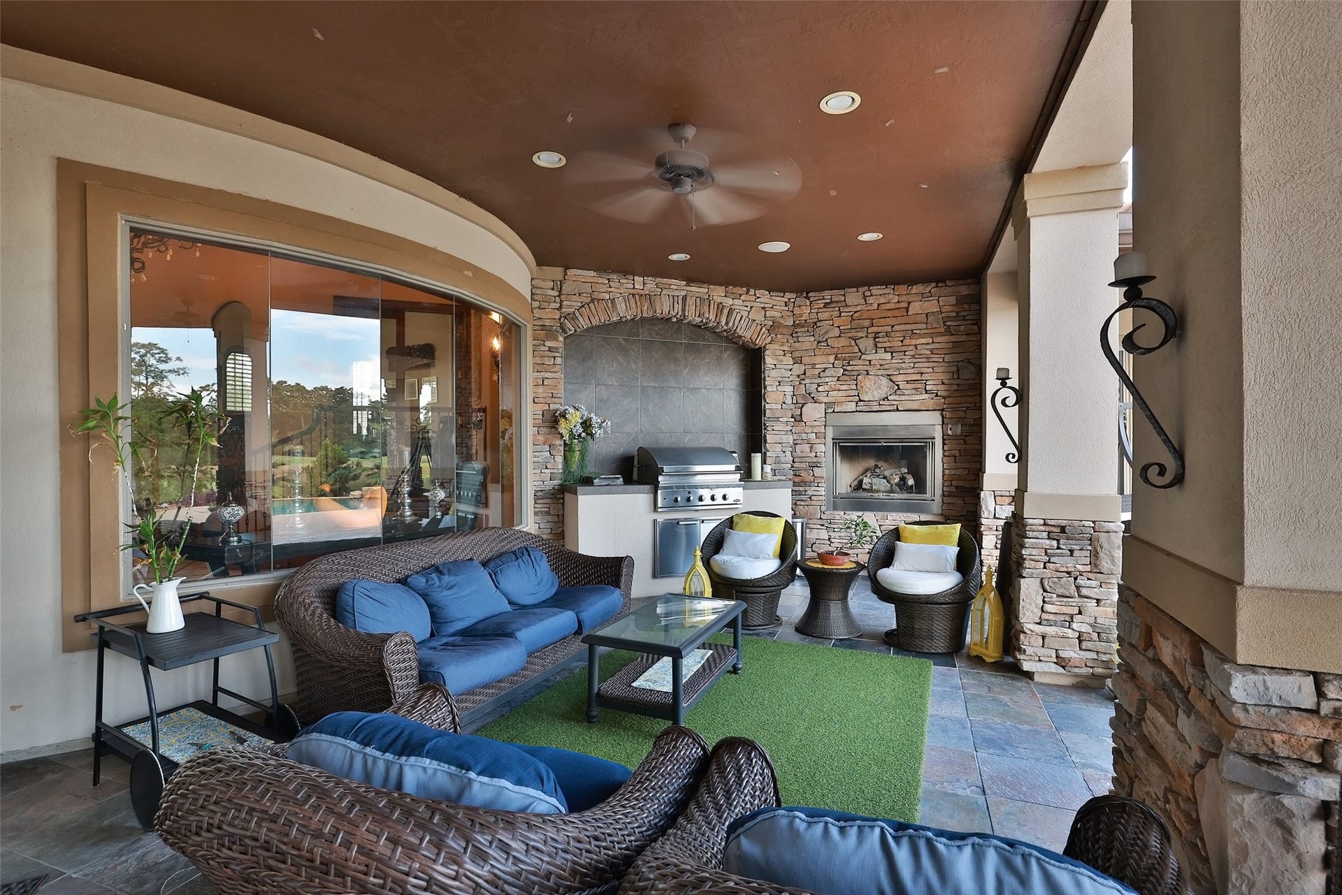 Fabulous covered patio with outdoor kitchen creates the perfect space for outdoor relaxing and entertaining.