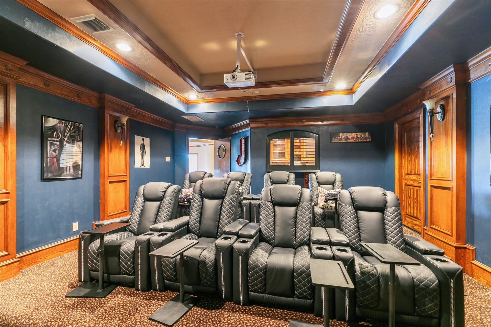 Another view of media room with window accessing wet bar.  Perfect for movie night and entertaining.