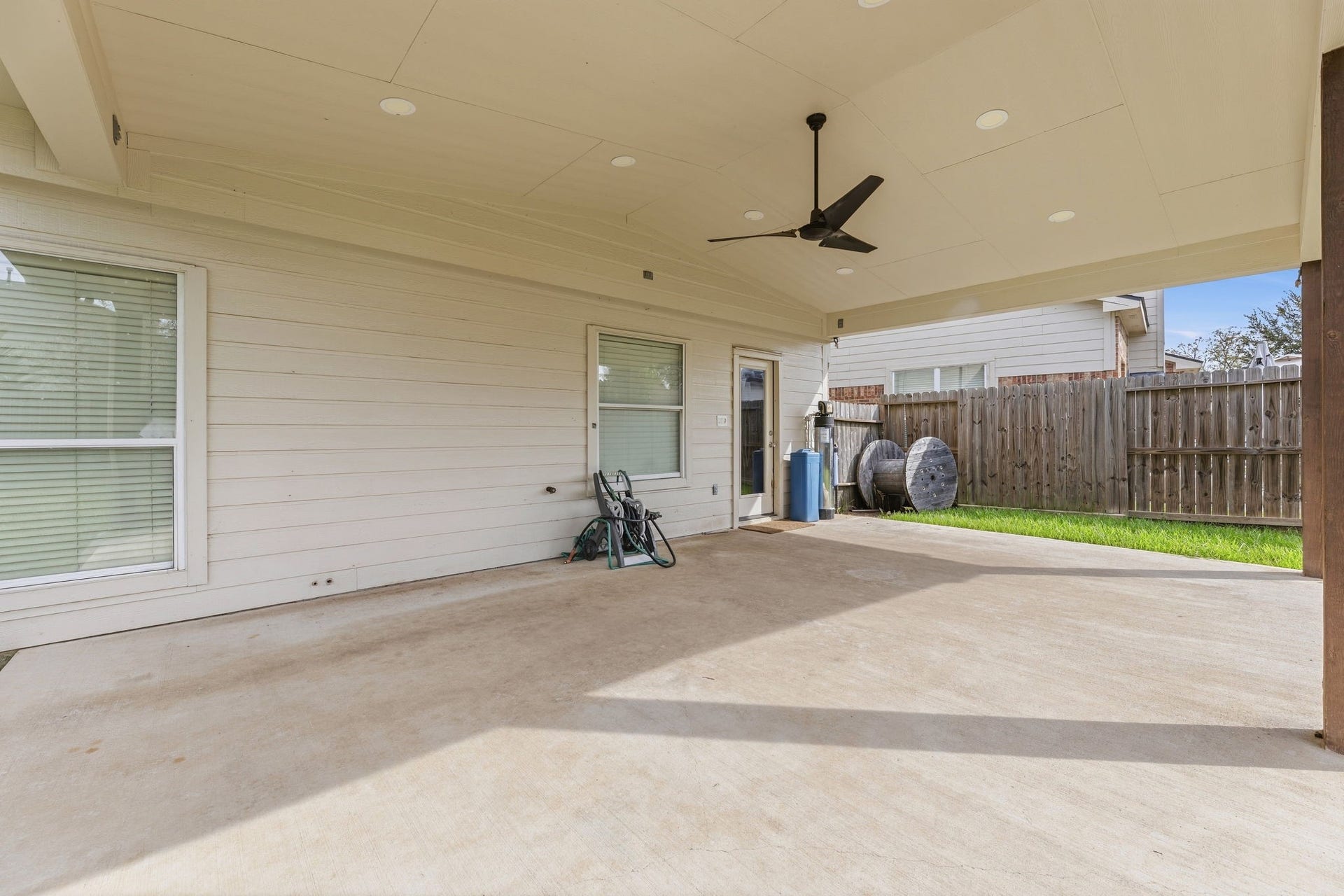 Another view of the covered patio. Flotrol water system is kept out here.