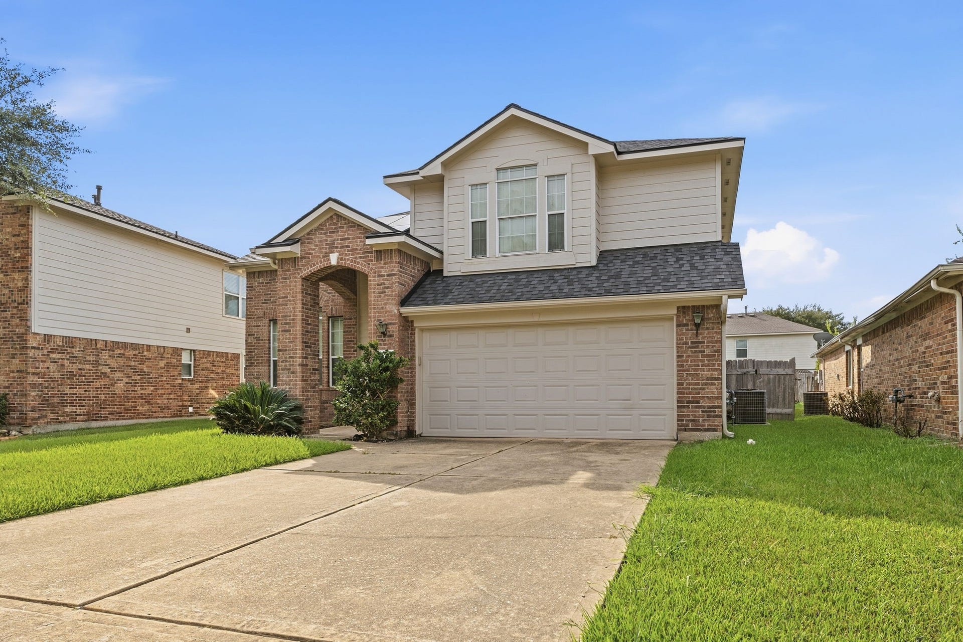 A long driveway gives you plenty of parking, and the side yard has easy access to the fenced backyard.