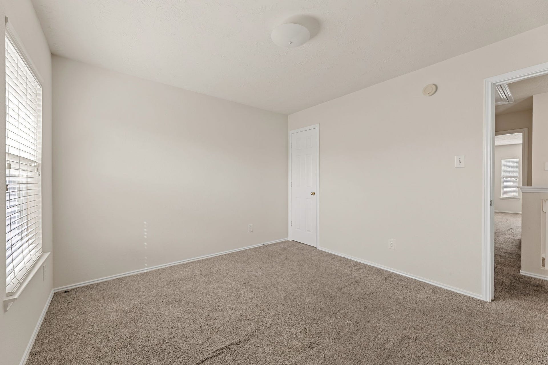 Neutral paint and soft carpet make it ready for any style.